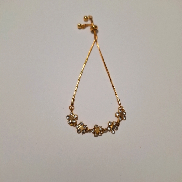 Jewelry - Goldtone flower bracelet- adjustable- New in package